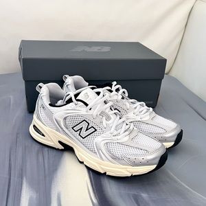 New Balance 530 women size 6.5/ Men 5/White with silver metallic and black/NEW